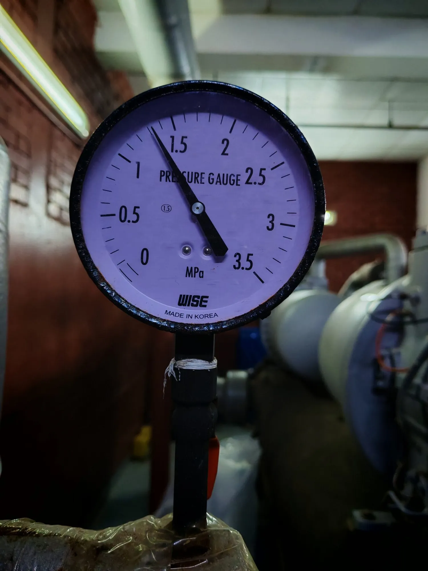 Close-up of a pressure gauge on a chilled water line
