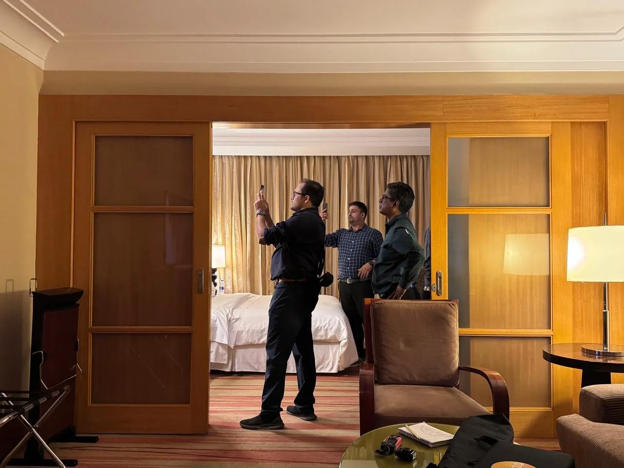Auditors surveying a hotel guest room for energy use