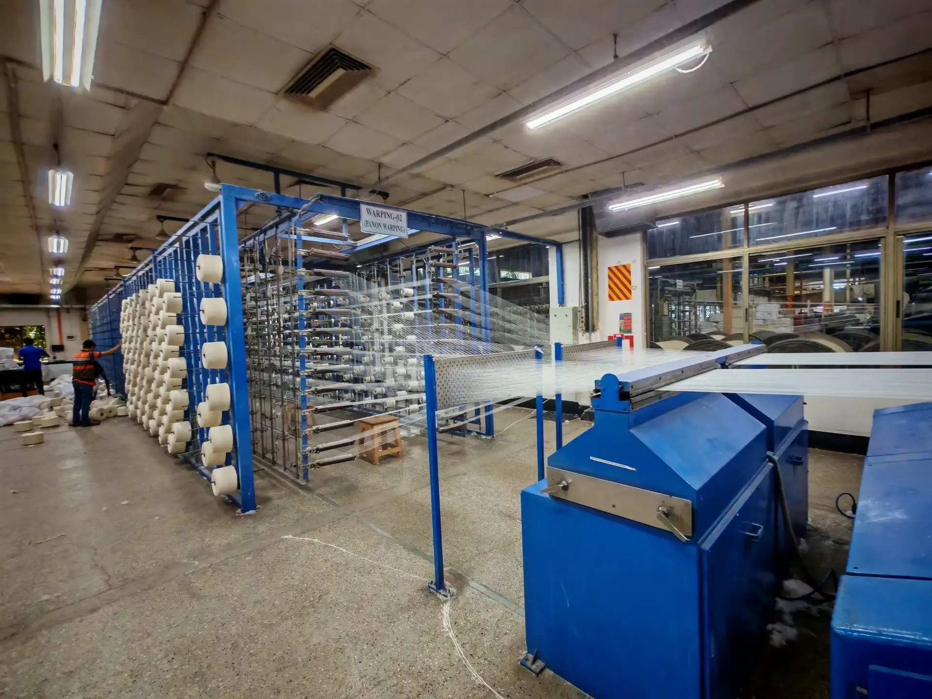 Textile production machinery with blue guarding
