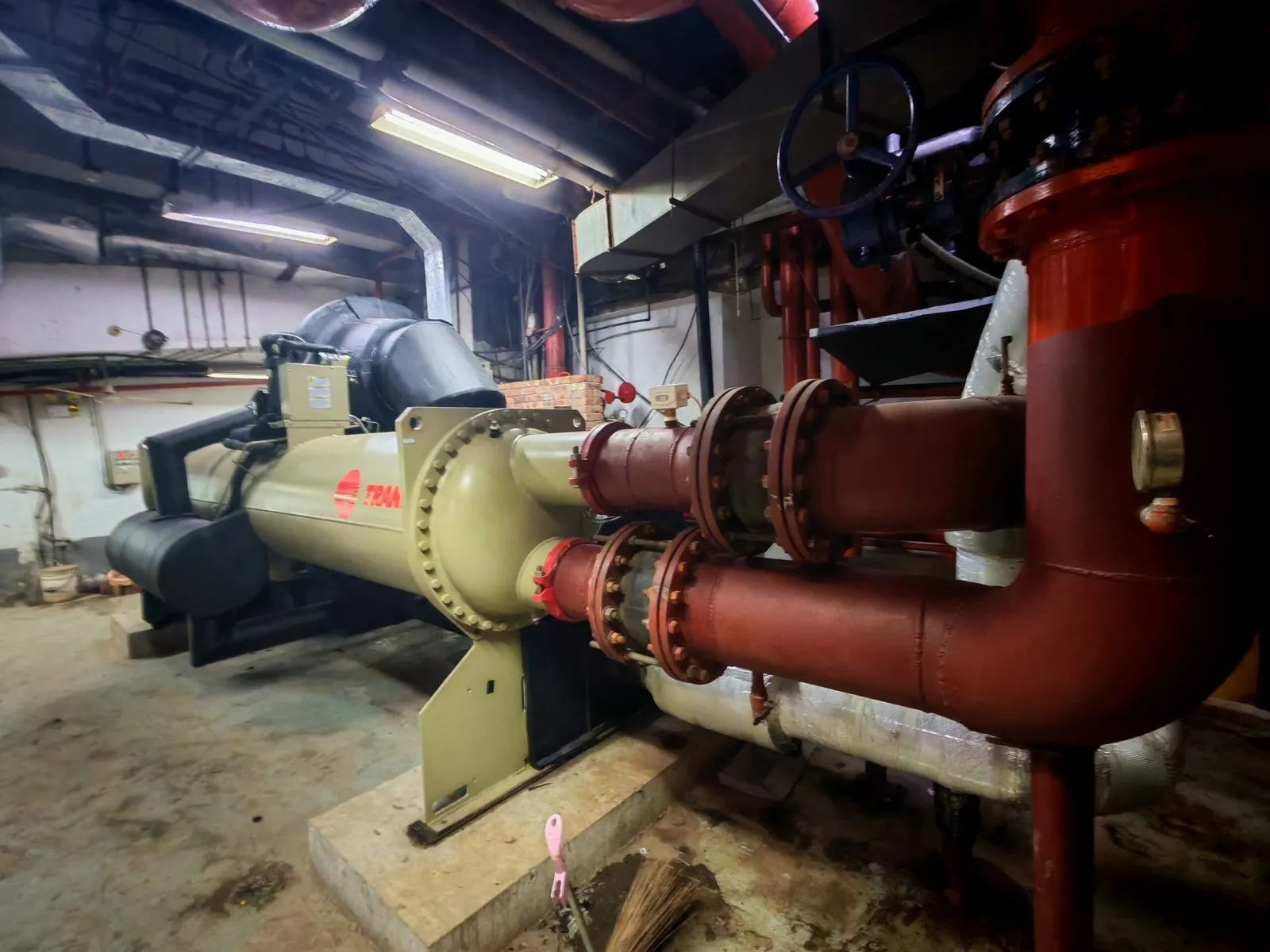 Chiller with red refrigerant and water pipework