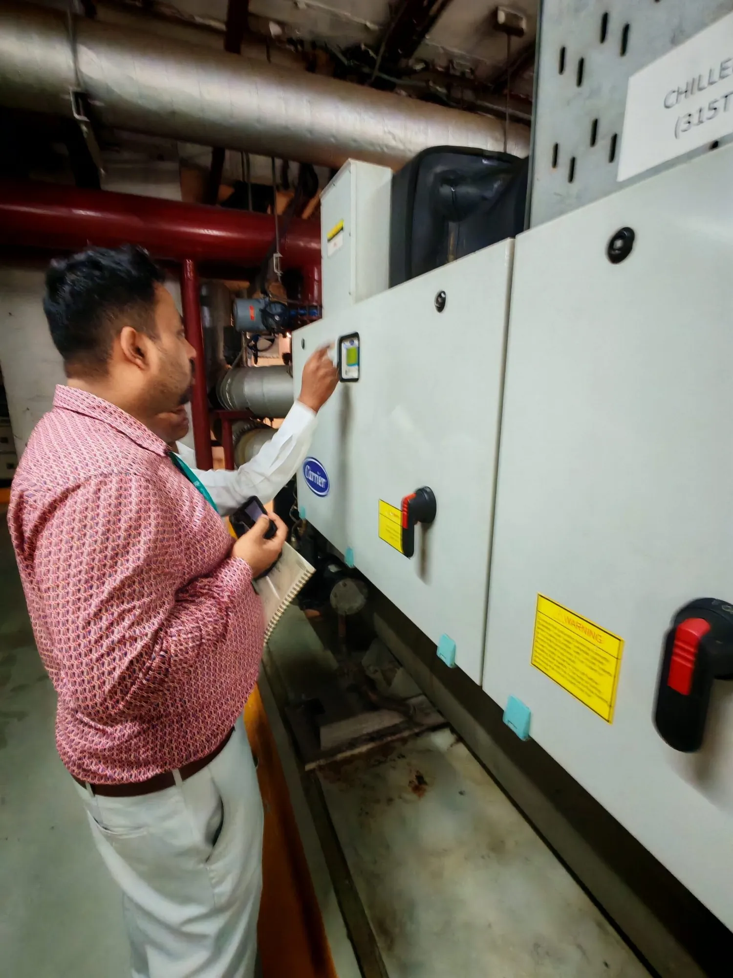 Engineer reading the controls of an air handling unit